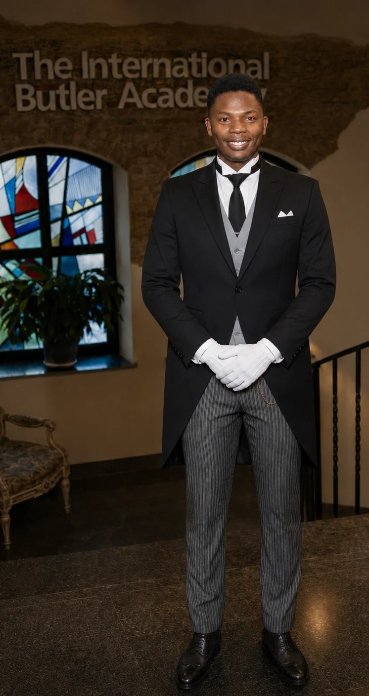 LIRU J. MASINDE in formal butler uniform at The International Butler Academy